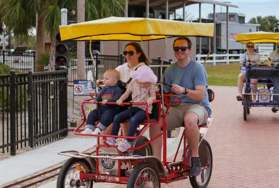 Families riding bikes at Lakes Park